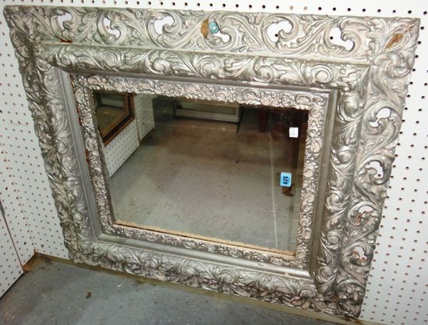 A silvered gilt frame rectangular wall mirror with heavily moulded frame.