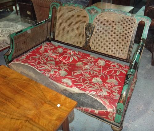 An early 20th century green chinoiserie decorated three piece suite.