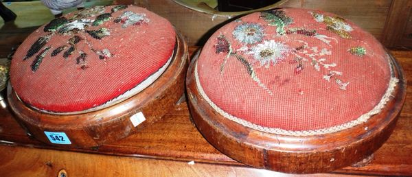 A pair of Victorian walnut circular stools.
