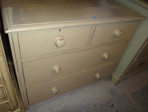 A painted pine chest of two short and two long drawers.