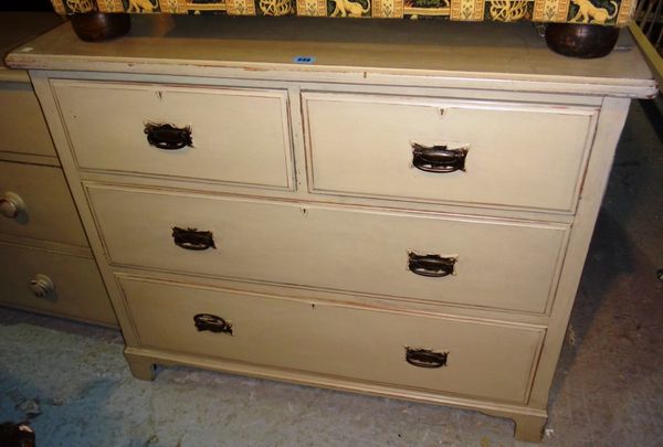 A painted pine chest of two short and two long drawers.
