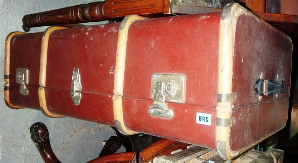 A 20th century wooden bound red travelling trunk.