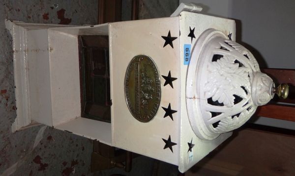 A small white painted cathedral type heater.