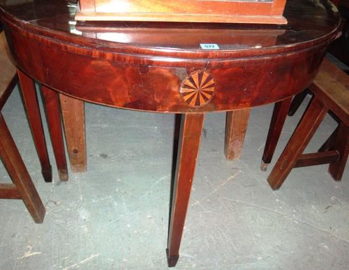 A 19th century mahogany and inlaid foldover tea table.