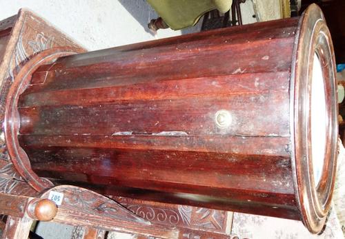A Victorian mahogany circular pot cupboard and a rosewood inlaid pot cupboard.