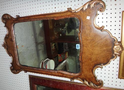 An early 18th century style walnut fret cut wall mirror.