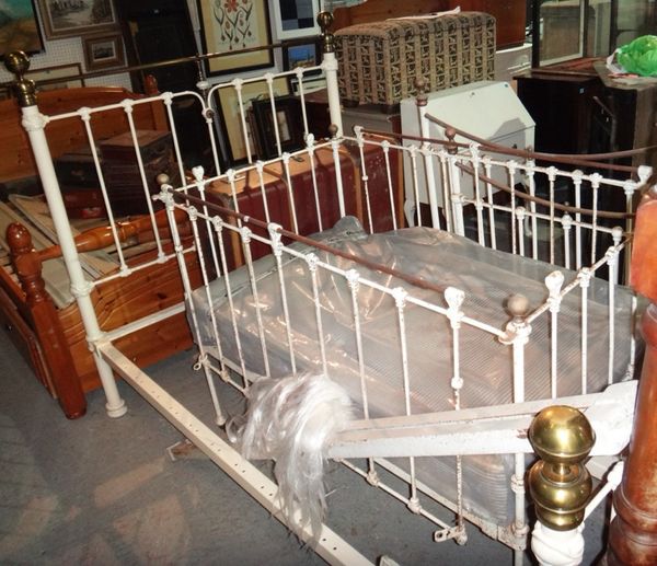 A 20th century cream painted metal double bed.
