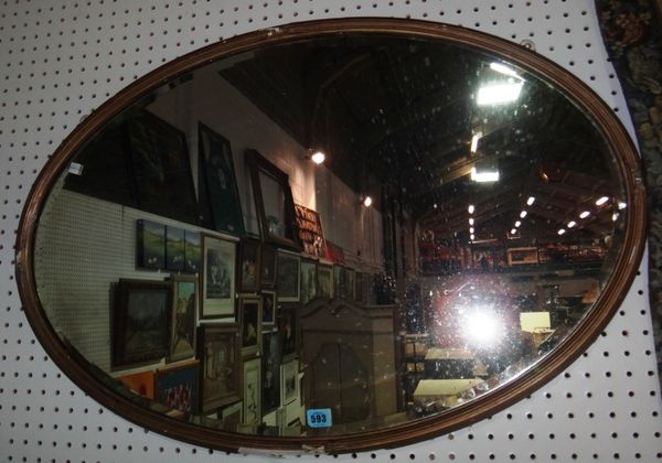 A 19th century oval gilt framed wall mirror.