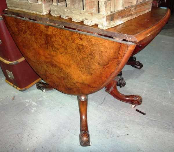 A 19th century walnut drop flap dining table.