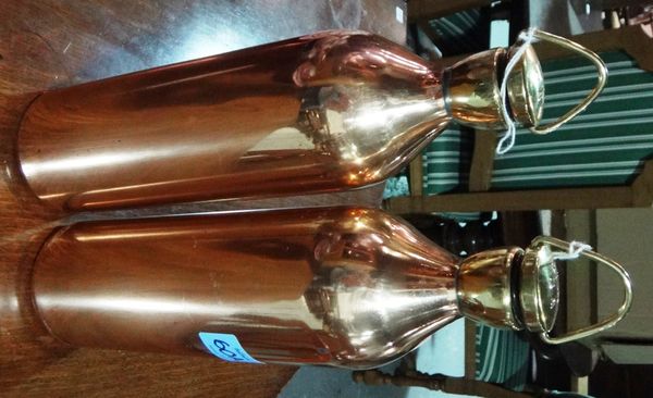 A pair of copper and brass flasks with screw caps, initialled W.D, dated 1914, World War I style.