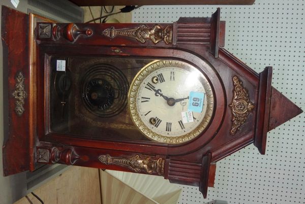 A walnut cased eight day mantel clock, together with a set of iron and brass balance scales.