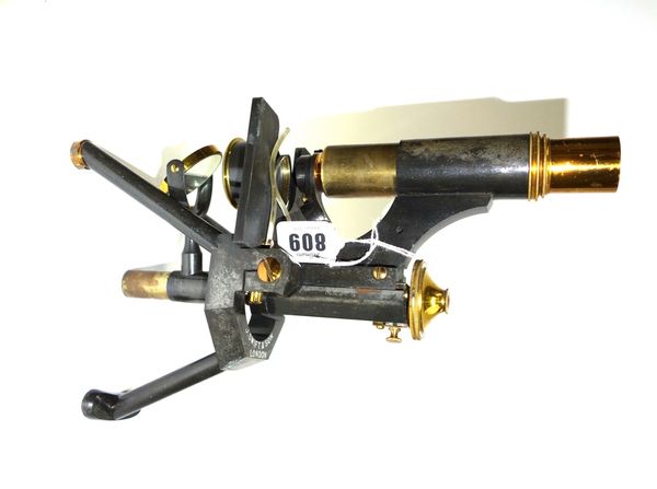 An ebonised brass microscope by 'J. Swift & Son, London', late 19th century, with sliding tube and fine focus adjustment, with spare objectives and ey