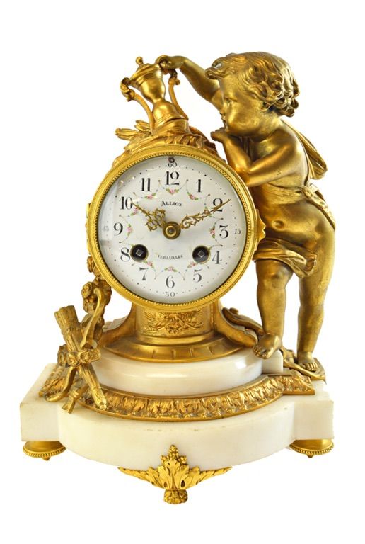 A Louis XIV ormolu and white marble mantel clock, early 19th century, the white enamel dial detailed 'Allion Versailles', the drum case mounted with a