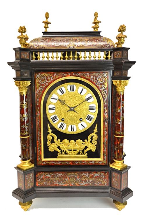 An ormolu mounted brass and pewter inlaid boulle work mantel clock, late 19th century, with foliate finials and railed gallery over four Corinthian co