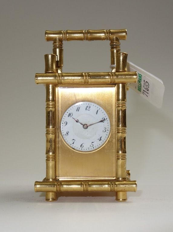 A miniature brass cased carriage clock, early 20th century, the faux bamboo case enclosing a single train movement, 8cm high (key).