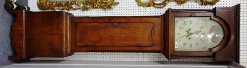 An early 19th century oak and mahogany banded eight day longcase clock, with painted dial and two train movement (adapted to chimes), over a pillared