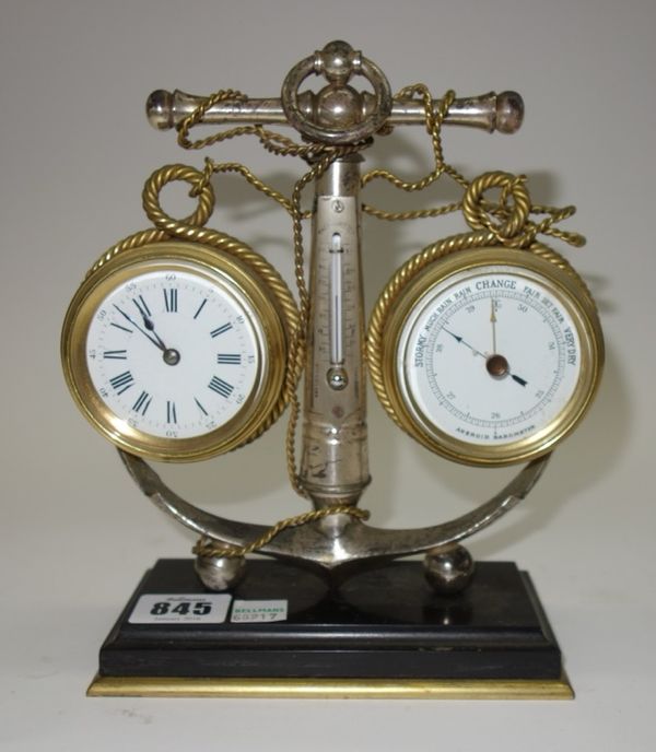 A silvered brass clock/barometer compendium, late 19th/early 20th century, the central anchor with applied thermometer, flanked by two enamel dials on