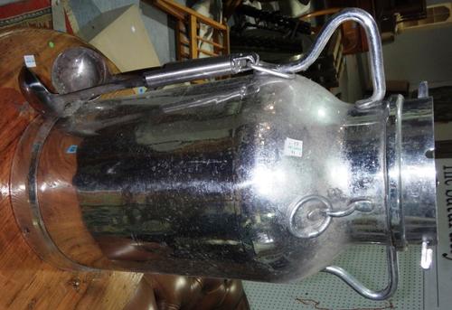 A pair of 20th century chrome plated twin handled churns and a hardwood ship's wheel.