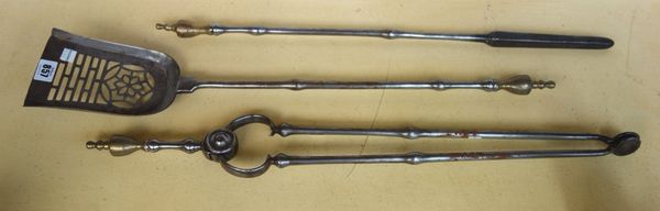 A set of three early Victorian steel and brass mounted fire tools, the shovel 69cm (3).  SN00535117 /001  item 318
