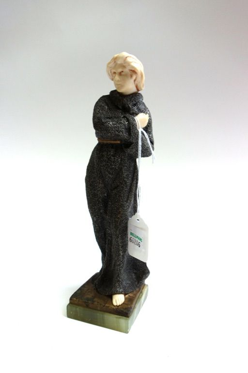 A. Foucher, 'Joan of Arc', a silvered and textured bronze and ivory figure, circa 1920, carved and cast as a young woman in a flowing belted cloak, si