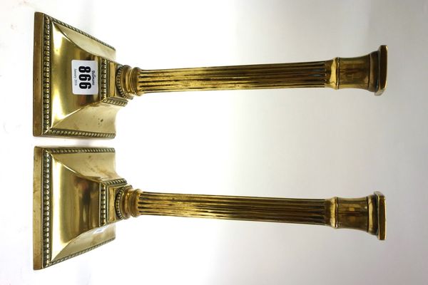 A pair of brass candlesticks by Edward Kendrick, early 19th century, of Corinthian column form, signed 'K.R.', 28cm high (2).