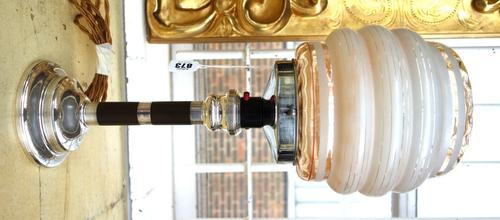 An Art Deco silver and bakelite mounted lamp, hallmarked for Birmingham 1929, with maker's mark of 'S. Blankensee & Sons Ltd', with a lobed amber and