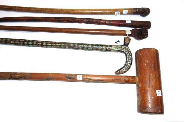 A Pitcairn walking stick, 19th century, the hardwood pommel carved as a clenched fist and detailed 'Pitcairn Island', 83cm, together with three other