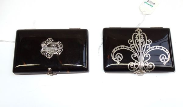 A Continental tortoiseshell and silver inlaid cigarette case cum aide memoire, circa 1900, and another similar with applied silver monogram, 10.6cm wi