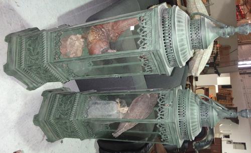 Taxidermy; a sparrow hawk mounted with it's prey housed in a glazed copper lantern and another similar.