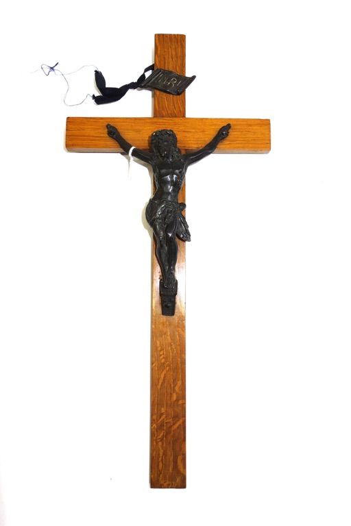 A patinated bronze Corpus Christi, early 20th century, mounted on an oak crucifix, 36cm high.