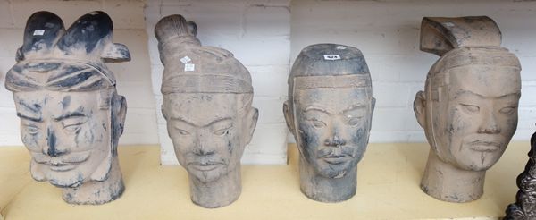A set of four modern pottery terracotta army figure heads, the tallest 41cm high.
