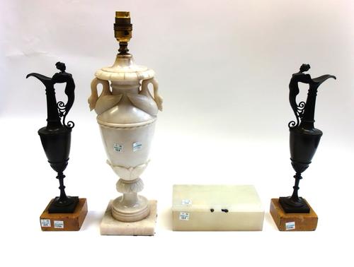 A pair of patinated bronze ewers, late 19th century, with anthropomorphic female handles on marble plinths, 32.5cm high overall, on an alabaster lamp