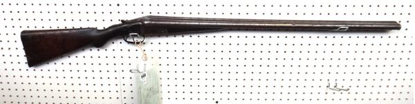 A 12 bore English double barrel shotgun, the steel barrel stamped 'Robert Hughes & Sons, Makers Birmingham', with foliate engraved lockplate and chequ