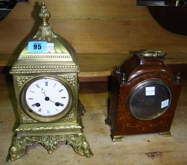 A Victoria brass cased eight day mantel clock, with pierced foliate decoration, together with an Edwardian inlaid mantel clock.