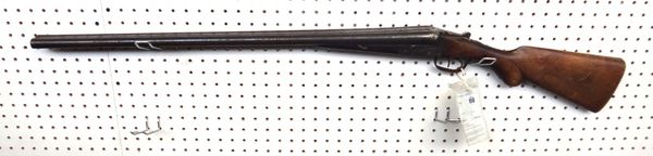 A 12 bore English double barrel shotgun, with plain steel barrels and lockplate with a walnut stock, deactivated 08/06/2012, with certificate.