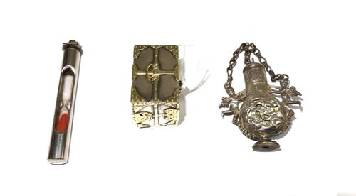 A gilt metal mounted model of a miniature safe, possibly Florentine, the hinged door opening to reveal three drawers, together with a sand timing glas