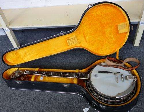 An Antoria full size banjo, rosewood cased, five strings with mother of pearl inlaid fret markers, in a fur lined hard case, 102cm.