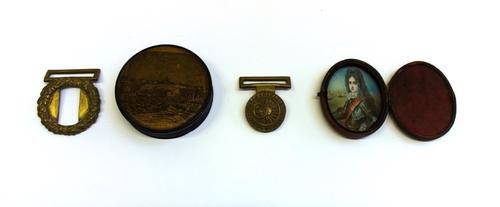A 19th century papier mache circular snuff box, decorated and titled 'Quebec Taken from the Sea' (8cm diameter), a cased miniature on ivory, a brass b