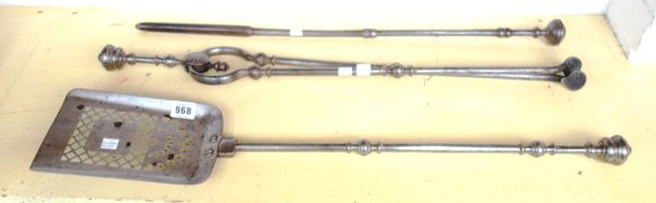 A set of three Victorian steel fire tools, all with turned pommels, the shovel (73cm long) with pierced plate (3).