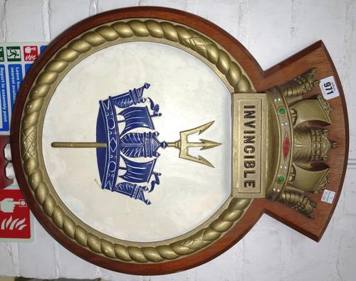 A pair of of garter boats bow badges, a decorated skull blade, a ship's plaque inscribed 'Invincible', and an image of a paddle steamer (5).