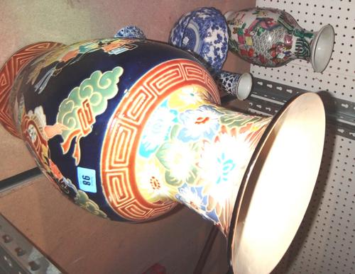 A quantity of ceramics including Oriental vases, a pair of blue and white candlesticks, a blue and white bowl and sundry.