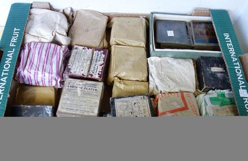 A Shiraz rug, South Persian, the madder field with a dual medallion and shaped black surround, with flowerhead motifs, an ivory floral border, 166cm x