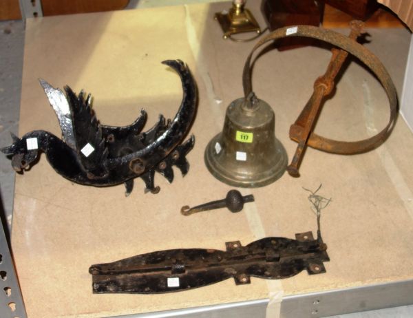A 18th century cast iron mechanical bracket formed as a griffin together with a bronze bell, reputedly from a monastery front door. (2)