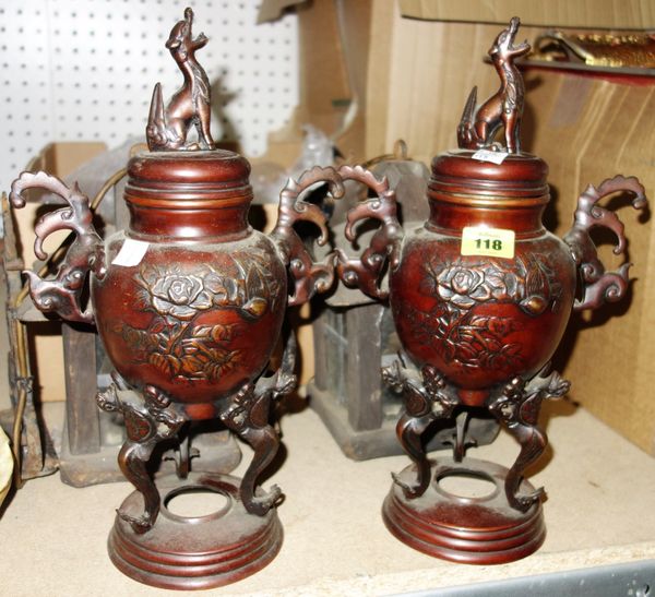 A pair of Oriental bronze lidded vases.(2)