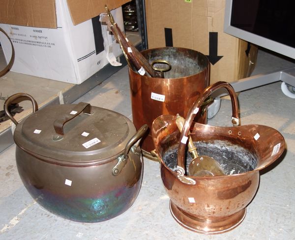 A quantity of metalware including; two brass door straps, hunting horn, copper helmet coal scuttle, a brass skimmer, a 19th century copper basting spo