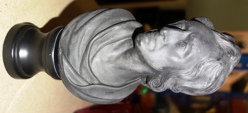 A Wedgwood black basalt bust of John Locke, probably late 18th century, modelled with head turned slightly to his right, on a  later painted wood socl