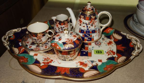 A Copeland part cabaret service, circa 1870, gilt Imari decorated, comprising; a two handled tray (44.5cm wide), a teapot and cover, a sucrier and cov