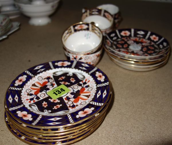 A Royal Crown Derby matched part tea service decorated in varying Imari patterns, comprising; five mixed teacups and saucers, five side plates, a simi