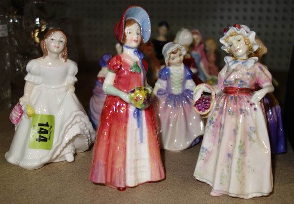 A quantity of Royal Doulton ceramic figures of ladies and a small boxed Moorcroft vase. (qty)