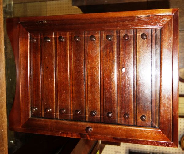 A miniature hardwood collectors chest with glazed door and nine drawers.